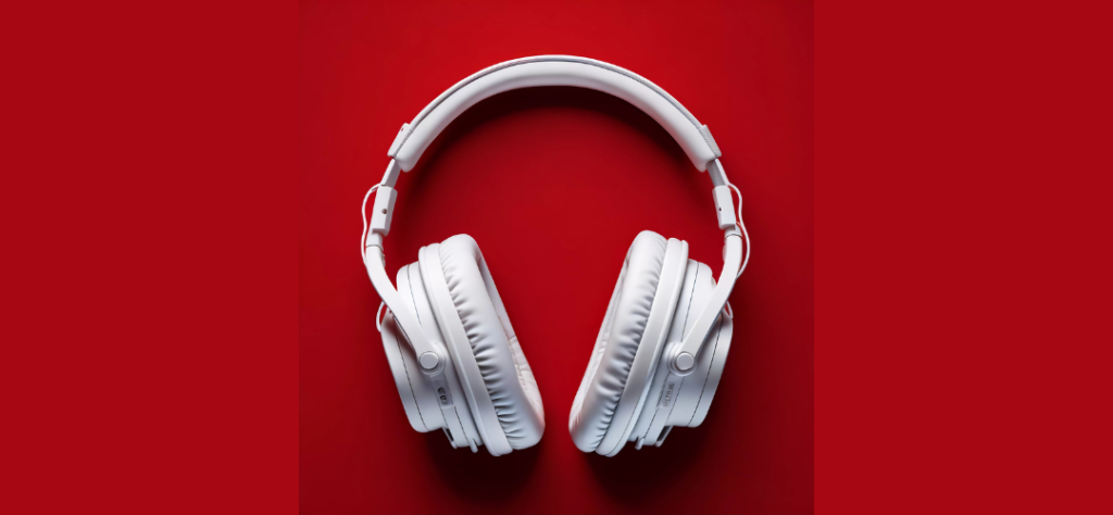 White Headphones on a red surface