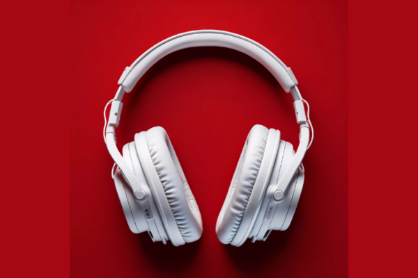 White Headphones on a red surface